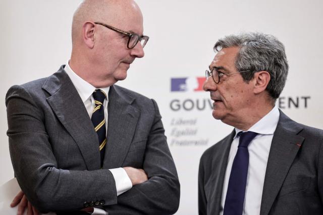 France's Economy, Finances and Industry Minister Roland Lescure (L) and France's Trade Minister Serge Papin (R) attend a press conference focusing on the consequences of the war in Iran and to announce "measures to support economic activity", at the Hotel Matignon Prime minister residence in Paris on May 21, 2026. (Photo by STEPHANE DE SAKUTIN / AFP)