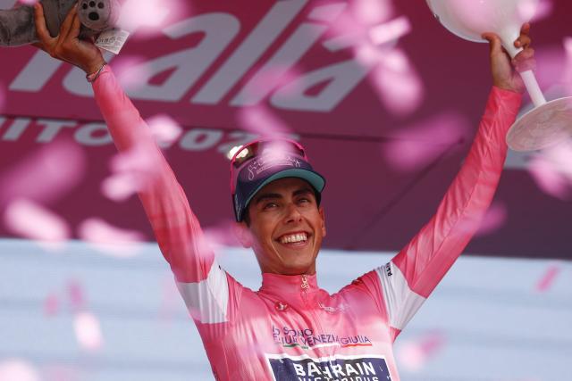 Bahrain - Victorious Portuguese rider Afonso Eulalio celebrates with the overall leader's pink jersey on the podium of the 12th stage of the Giro d'Italia 2026 - Tour of Italy cycling race between Imperia and Novi Ligure, Italy, on May 21, 2026. (Photo by Luca Bettini / AFP)