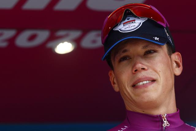 Soudal Quick-Step French rider Paul Magnier celebrates the best sprinter's purple jersey on the podium of the 12th stage of the Giro d'Italia 2026 - Tour of Italy cycling race between Imperia and Novi Ligure, Italy, on May 21, 2026. (Photo by Luca Bettini / AFP)