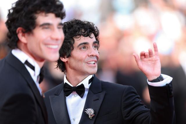 Spanish director, screenwriter and producer Javier Calvo and Spanish director, screenwriter and producer Javier Ambrossi arrive for the screening of the film "La Bola Negra" at the 79th edition of the Cannes Film Festival in Cannes, southern France on May 21, 2026. (Photo by Sameer AL-DOUMY / AFP)