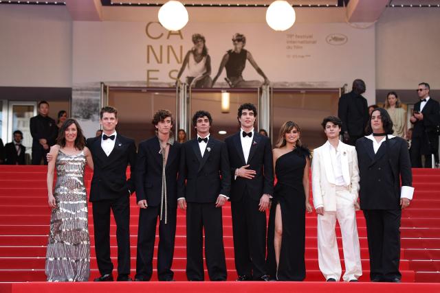 (From L) Spanish actress Lola Duenas, Spanish actor Miguel Bernardeau, Spanish actor Alvaro Lafuente, Spanish director, screenwriter and producer Javier Ambrossi, Spanish director, screenwriter and producer Javier Calvo, Spanish actress Penelope Cruz, actor Milo Quifes and Venezuelan actor Carlos Gonzalez arrive for the screening of the film "La Bola Negra" at the 79th edition of the Cannes Film Festival in Cannes, southern France on May 21, 2026. (Photo by Sameer AL-DOUMY / AFP)