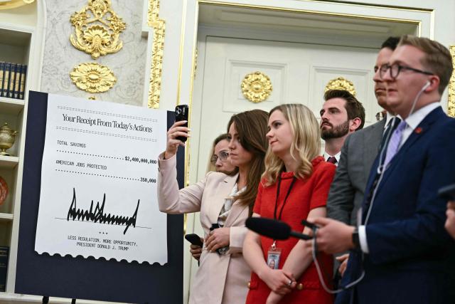 Reporters listen as US President Donald Trump speaks during an announcement with Environmental Protection Agency (EPA) Administrator Lee Zeldin in the Oval Office of the White House in Washington, DC on May 21, 2026. (Photo by Kent NISHIMURA / AFP)
