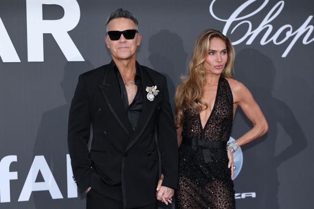 British singer-Songwriter Robbie Williams and US actress and television personality Ayda Field attend the annual American Foundation for AIDS Research amfAR Gala Cannes 2026 at the Hotel du Cap-Eden-Roc in Cap d'Antibes, southern France, on the sidelines of the 79th edition of the Cannes Film Festival on May 21, 2026. (Photo by Thibaud MORITZ / AFP)