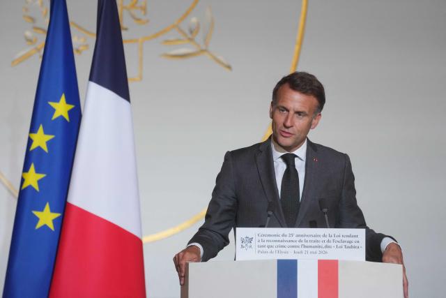 France's President Emmanuel Macron delivers a speech during a ceremony marking the 25th anniversary of the law recognizing the slave trade and slavery as crimes against humanity at the Elysee Palace in Paris, on May 21, 2026. (Photo by Thibault Camus / POOL / AFP)