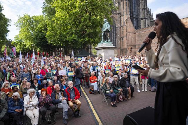 Demonstrators take part at a rally in solidarity with refugees and in response to recent protests against asylum seeker centers in The Netherlands, in Utrecht on May 21, 2026. (Photo by Jeroen Jumelet / ANP / AFP) / Netherlands OUT
