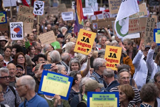 Demonstrators take part at a rally in solidarity with refugees and in response to recent protests against asylum seeker centers in The Netherlands, in Utrecht on May 21, 2026. (Photo by Jeroen Jumelet / ANP / AFP) / Netherlands OUT