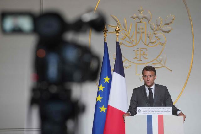 France's President Emmanuel Macron delivers a speech during a ceremony marking the 25th anniversary of the law recognizing the slave trade and slavery as crimes against humanity at the Elysee Palace in Paris, on May 21, 2026. (Photo by Thibault Camus / POOL / AFP)