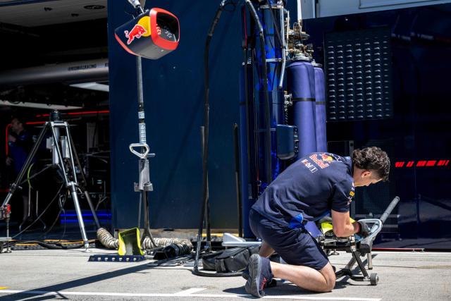 A Red Bull Rancing pit crew members prepares ahead of the 2026 Formula 1 Grand Prix du Canada at Circuit Gilles-Villeneuve in Montreal, Canada, on May 21, 2026. (Photo by ANDREJ IVANOV / AFP)