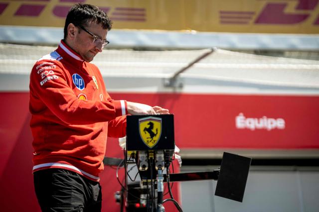 A Ferrari pit crew member prepares ahead of the 2026 Formula 1 Grand Prix du Canada at Circuit Gilles-Villeneuve in Montreal, Canada, on May 21, 2026. (Photo by ANDREJ IVANOV / AFP)