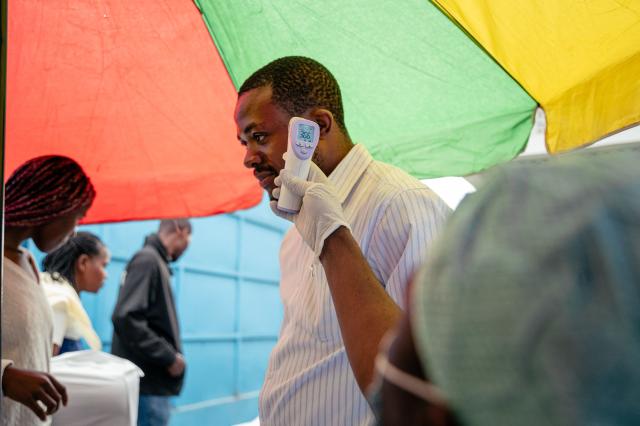 A visitor at the CBCA Virunga hospital has his temperature checked at a screening checkpoint set up at the hospital entrance as part of Ebola prevention measures in Goma, on May 21, 2026. An Ebola outbreak in the Democratic Republic of Congo has spread to eastern South Kivu province in an area under the control of the Rwanda-backed M23 militia, the group's spokesman said Thursday, heightening fears of the deadly disease's growing reach.
Efforts to get a grip on the latest outbreak of the highly contagious haemorrhagic fever, which the World Health Organization has declared an international emergency, have been hampered by the DRC's long-running conflicts, including between the Congolese army and the M23. Having seized swathes of land in the mineral-rich east with Rwanda's help, the M23 has installed a parallel administration to the Congolese government in areas under its control. (Photo by Jospin Mwisha / AFP)