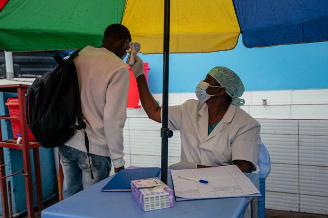 A visitor at the CBCA Virunga hospital has his temperature checked at a screening checkpoint set up at the hospital entrance as part of Ebola prevention measures in Goma, on May 21, 2026. An Ebola outbreak in the Democratic Republic of Congo has spread to eastern South Kivu province in an area under the control of the Rwanda-backed M23 militia, the group's spokesman said Thursday, heightening fears of the deadly disease's growing reach.
Efforts to get a grip on the latest outbreak of the highly contagious haemorrhagic fever, which the World Health Organization has declared an international emergency, have been hampered by the DRC's long-running conflicts, including between the Congolese army and the M23. Having seized swathes of land in the mineral-rich east with Rwanda's help, the M23 has installed a parallel administration to the Congolese government in areas under its control. (Photo by Jospin Mwisha / AFP)