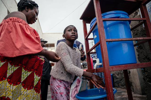A visitor at the CBCA Virunga hospital washes his hands before leaving the hospital as part of Ebola prevention measures in Goma, on May 21, 2026. An Ebola outbreak in the Democratic Republic of Congo has spread to eastern South Kivu province in an area under the control of the Rwanda-backed M23 militia, the group's spokesman said Thursday, heightening fears of the deadly disease's growing reach.
Efforts to get a grip on the latest outbreak of the highly contagious haemorrhagic fever, which the World Health Organization has declared an international emergency, have been hampered by the DRC's long-running conflicts, including between the Congolese army and the M23. Having seized swathes of land in the mineral-rich east with Rwanda's help, the M23 has installed a parallel administration to the Congolese government in areas under its control. (Photo by Jospin Mwisha / AFP)
