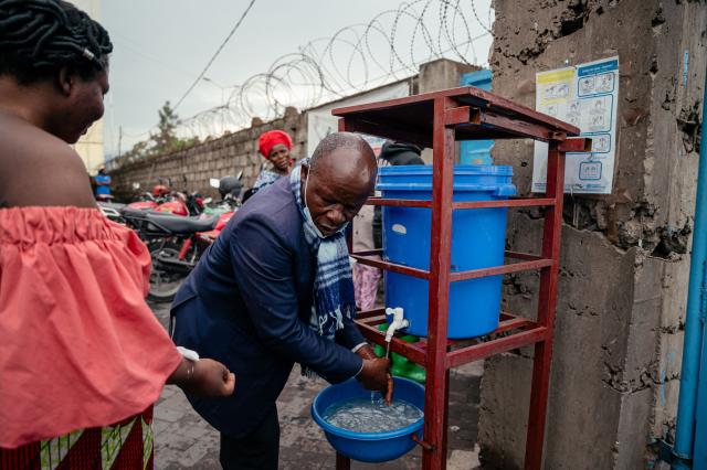 A visitor at the CBCA Virunga hospital washes his hands before leaving the hospital as part of Ebola prevention measures in Goma, on May 21, 2026. An Ebola outbreak in the Democratic Republic of Congo has spread to eastern South Kivu province in an area under the control of the Rwanda-backed M23 militia, the group's spokesman said Thursday, heightening fears of the deadly disease's growing reach.
Efforts to get a grip on the latest outbreak of the highly contagious haemorrhagic fever, which the World Health Organization has declared an international emergency, have been hampered by the DRC's long-running conflicts, including between the Congolese army and the M23. Having seized swathes of land in the mineral-rich east with Rwanda's help, the M23 has installed a parallel administration to the Congolese government in areas under its control. (Photo by Jospin Mwisha / AFP)