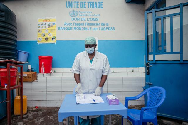 A doctor from CBCA Virunga hospital prepares to checks a visitors temperature at a screening checkpoint set up at the hospital entrance as part of Ebola prevention measures in Goma, on May 21, 2026. An Ebola outbreak in the Democratic Republic of Congo has spread to eastern South Kivu province in an area under the control of the Rwanda-backed M23 militia, the group's spokesman said Thursday, heightening fears of the deadly disease's growing reach.
Efforts to get a grip on the latest outbreak of the highly contagious haemorrhagic fever, which the World Health Organization has declared an international emergency, have been hampered by the DRC's long-running conflicts, including between the Congolese army and the M23. Having seized swathes of land in the mineral-rich east with Rwanda's help, the M23 has installed a parallel administration to the Congolese government in areas under its control. (Photo by Jospin Mwisha / AFP)