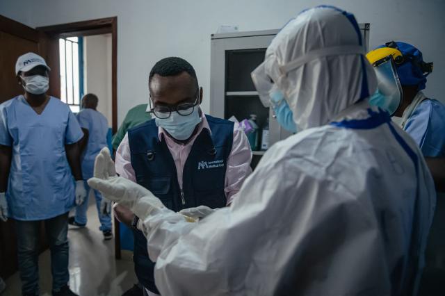 Dr Abdou Sebushishe, Senior Health Advisor at International Medical Corps, guides and shows CBCA Virunga doctors how to properly put on single-use personal protective equipment provided by International Medical Corps, as part of support for Ebola virus disease prevention measures in Goma, on May 21, 2026. An Ebola outbreak in the Democratic Republic of Congo has spread to eastern South Kivu province in an area under the control of the Rwanda-backed M23 militia, the group's spokesman said Thursday, heightening fears of the deadly disease's growing reach.
Efforts to get a grip on the latest outbreak of the highly contagious haemorrhagic fever, which the World Health Organization has declared an international emergency, have been hampered by the DRC's long-running conflicts, including between the Congolese army and the M23. Having seized swathes of land in the mineral-rich east with Rwanda's help, the M23 has installed a parallel administration to the Congolese government in areas under its control. (Photo by Jospin Mwisha / AFP)