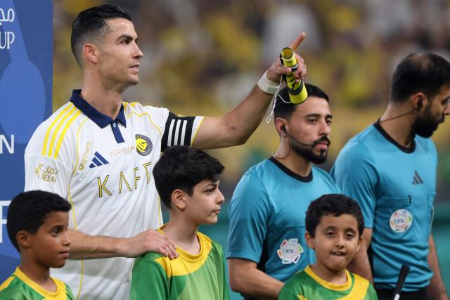 Nassr's Portuguese forward #07 Cristiano Ronaldo gestures to spectators before the start of the Saudi Pro League football match between Al-Nassr and Damac at the Al-Awwal Park Stadium in Riyadh on May 21, 2026. (Photo by Fayez NURELDINE / AFP)