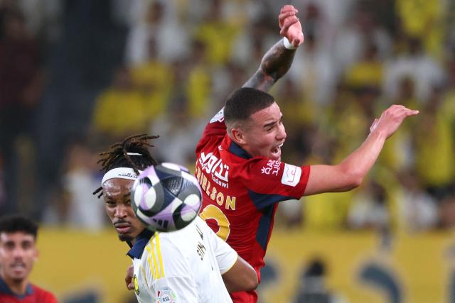 Nassr's French defender #03 Mohamed Simakan (front) heads the ball next to Damac's Brazilian forward #99 Arielson during the Saudi Pro League football match between Al-Nassr and Damac at the Al-Awwal Park Stadium in Riyadh on May 21, 2026. (Photo by Fayez NURELDINE / AFP)