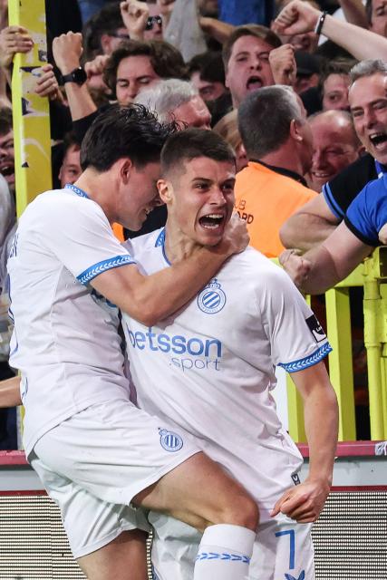 Club Brugge's Italian forward #07 Nicolo Tresoldi (C) celebrates with fans after scoring his team's second goal during the Belgian "Pro League" First Division football match between KV Mechelen and Club Brugge at Achter De Kazerne stadium in Mechelen on May 21, 206. (Photo by BRUNO FAHY / BELGA / AFP) / Belgium OUT