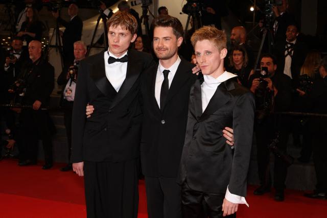 (From L) Belgian actor Emmanuel Macchia, Belgian director Lukas Dhont and French actor Valentin Campagne arrive for the screening of the film "Coward" at the 79th edition of the Cannes Film Festival in Cannes, southern France on May 21, 2026. (Photo by Valery HACHE / AFP)