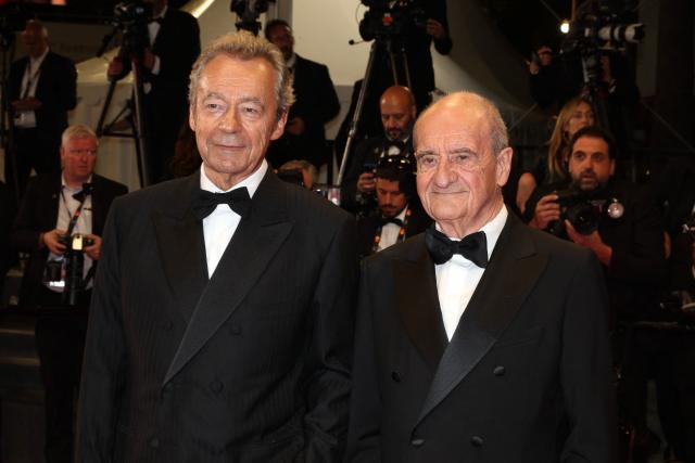 French journalist Michel Denisot (L) and French journalist and former president of the cannes film festival Pierre Lescure arrive for the screening of the film "Coward" at the 79th edition of the Cannes Film Festival in Cannes, southern France on May 21, 2026. (Photo by Valery HACHE / AFP)