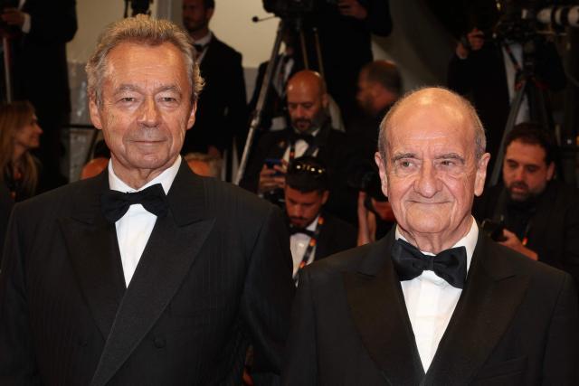 French journalist Michel Denisot (L) and French journalist and former president of the cannes film festival Pierre Lescure arrive for the screening of the film "Coward" at the 79th edition of the Cannes Film Festival in Cannes, southern France on May 21, 2026. (Photo by Valery HACHE / AFP)