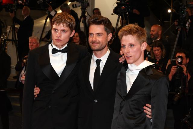 (From L) Belgian actor Emmanuel Macchia, Belgian director Lukas Dhont and French actor Valentin Campagne arrive for the screening of the film "Coward" at the 79th edition of the Cannes Film Festival in Cannes, southern France on May 21, 2026. (Photo by Valery HACHE / AFP)