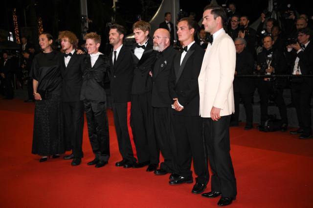 (From L) French producer Juliette Schrameck, actor Jef Jacobs, Belgian actor Emmanuel Macchia, Belgian director Lukas Dhont, French actor Valentin Campagne, Belgian screenwriter and actor Angelo Tijssens, Belgian actor Willem De Schryver and Belgian producer Michiel Dhont arrive for the screening of the film "Coward" at the 79th edition of the Cannes Film Festival in Cannes, southern France on May 21, 2026. (Photo by Olivier CHASSIGNOLE / AFP)