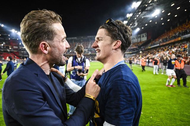 Club's team manager Devy Rigaux (L) and Club Brugge's Greek forward #08 Christos Tzolis celebrate winning the championship title after the Belgian Pro League play-off football match between KV Mechelen and Club Brugge at Achter De Kazerne stadium in Mechelen on May 21, 2026. (Photo by Tom Goyvaerts / BELGA / AFP) / Belgium OUT