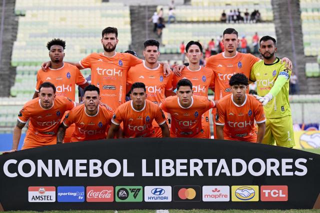 PLayers of Deportivo La Guaira pose for a picture ahead of the Copa Libertadores group stage football match between Venezuela's Deportivo La Guaira and Argentina's Independiente Rivadavia at the Olimpico de la UCV stadium in Caracas on May 21, 2026. (Photo by Federico PARRA / AFP)