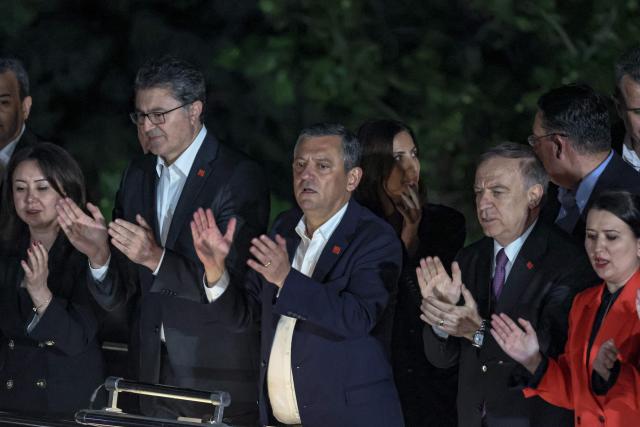 Ozgur Ozel (C), Leader of Republican People's Party (CHP) addresses a speech at their party headquarters during a protest against allegations of vote buying at the CHP congress in November 2023, in Ankara, on May 21, 2026. An Ankara court on May 21 annulled the 2023 leadership election of Turkey's main opposition CHP party, state news agency Anadolu reported, in a sharp escalation against the country's embattled opposition. The ruling overturns the result of the leadership election that brought in current party head Ozgur Ozel -- and ordered that the party's former longterm chair, Kemal Kilicdaroglu -- who lost the election to Ozel -- take over as interim leader. (Photo by ADEM ALTAN / AFP)