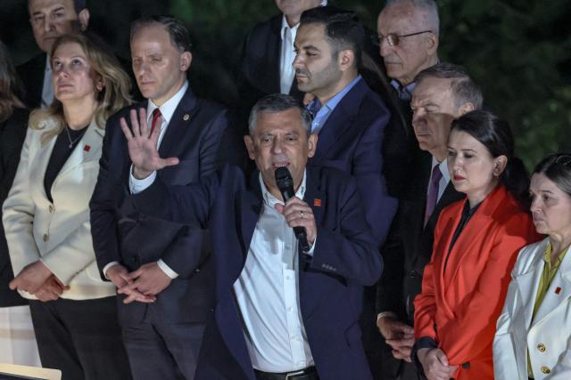 Ozgur Ozel (C), Leader of Republican People's Party (CHP) addresses a speech at their party headquarters during a protest against allegations of vote buying at the CHP congress in November 2023, in Ankara, on May 21, 2026. An Ankara court on May 21 annulled the 2023 leadership election of Turkey's main opposition CHP party, state news agency Anadolu reported, in a sharp escalation against the country's embattled opposition. The ruling overturns the result of the leadership election that brought in current party head Ozgur Ozel -- and ordered that the party's former longterm chair, Kemal Kilicdaroglu -- who lost the election to Ozel -- take over as interim leader. (Photo by ADEM ALTAN / AFP)