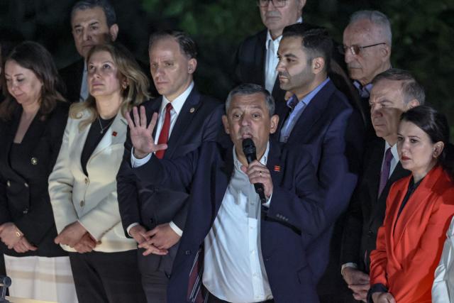 Ozgur Ozel (C), Leader of Republican People's Party (CHP) addresses a speech at their party headquarters during a protest against allegations of vote buying at the CHP congress in November 2023, in Ankara, on May 21, 2026. An Ankara court on May 21 annulled the 2023 leadership election of Turkey's main opposition CHP party, state news agency Anadolu reported, in a sharp escalation against the country's embattled opposition. The ruling overturns the result of the leadership election that brought in current party head Ozgur Ozel -- and ordered that the party's former longterm chair, Kemal Kilicdaroglu -- who lost the election to Ozel -- take over as interim leader. (Photo by ADEM ALTAN / AFP)
