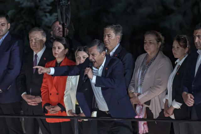 Ozgur Ozel (C), Leader of Republican People's Party (CHP) addresses a speech at their party headquarters during a protest against allegations of vote buying at the CHP congress in November 2023, in Ankara, on May 21, 2026. An Ankara court on May 21 annulled the 2023 leadership election of Turkey's main opposition CHP party, state news agency Anadolu reported, in a sharp escalation against the country's embattled opposition. The ruling overturns the result of the leadership election that brought in current party head Ozgur Ozel -- and ordered that the party's former longterm chair, Kemal Kilicdaroglu -- who lost the election to Ozel -- take over as interim leader. (Photo by ADEM ALTAN / AFP)
