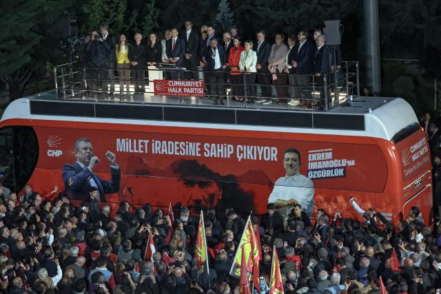 Ozgur Ozel (Top C), Leader of Republican People's Party (CHP) addresses a speech at their party headquarters during a protest against allegations of vote buying at the CHP congress in November 2023, in Ankara, on May 21, 2026. An Ankara court on May 21 annulled the 2023 leadership election of Turkey's main opposition CHP party, state news agency Anadolu reported, in a sharp escalation against the country's embattled opposition. The ruling overturns the result of the leadership election that brought in current party head Ozgur Ozel -- and ordered that the party's former longterm chair, Kemal Kilicdaroglu -- who lost the election to Ozel -- take over as interim leader. (Photo by ADEM ALTAN / AFP)