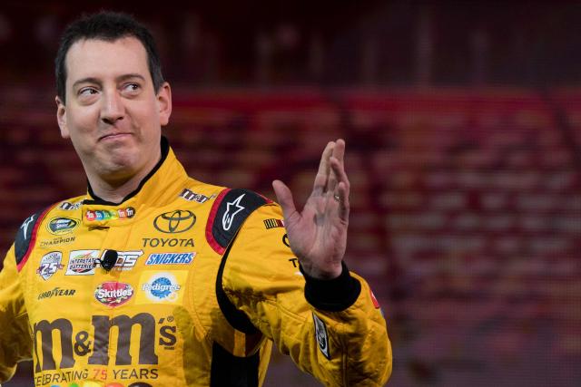 (FILES) 2015 NASCAR Sprint Cup Series Champion Kyle Busch waves as he arrives at the Toyota press conference during the 2017 North American International Auto Show in Detroit, Michigan, on January 9, 2017. NASCAR star Kyle Busch, a two-time Cup series champion regarded as one of the sport's greatest ever drivers, died May 21, 2026 aged 41, his family confirmed in a joint statement. He was in his 22nd season in NASCAR's top division and had been hospitalized earlier Thursday with an undisclosed but "severe illness". (Photo by JIM WATSON / AFP)
