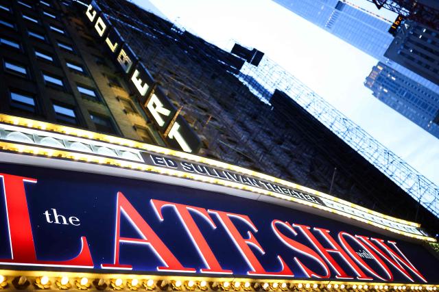 The exterior of the Ed Sullivan Theater is seen after the taping of the final episode of the "The Late Show" after 32 years on air, in New York, on May 21, 2026. "The Late Show" frontman Stephen Colbert will host the final edition of the 33-year-old US cultural institution on May 21, after it was cancelled by CBS as the network courted President Donald Trump. The show, which Colbert has hosted since 2015, was axed after he mocked the broadcaster for a $16 million settlement with Trump for allegedly "maliciously" editing an interview with his Democratic election rival Kamala Harris. (Photo by CHARLY TRIBALLEAU / AFP)