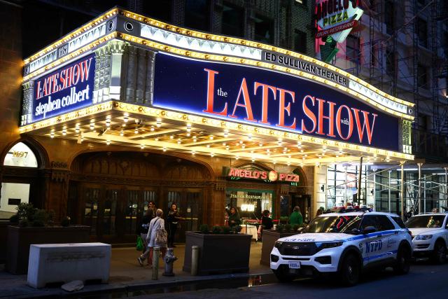 The exterior of the Ed Sullivan Theater is seen after the taping of the final episode of the "The Late Show" after 32 years on air, in New York, on May 21, 2026. "The Late Show" frontman Stephen Colbert will host the final edition of the 33-year-old US cultural institution on May 21, after it was cancelled by CBS as the network courted President Donald Trump. The show, which Colbert has hosted since 2015, was axed after he mocked the broadcaster for a $16 million settlement with Trump for allegedly "maliciously" editing an interview with his Democratic election rival Kamala Harris. (Photo by CHARLY TRIBALLEAU / AFP)