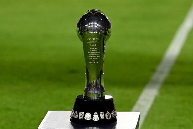 The Liga MX trophy is displayed on the pitch ahead of the Liga MX Clausura final first-leg football match between Cruz Azul and Pumas at the Ciudad de los Deportes Stadium in Mexico City on May 21, 2026. (Photo by Alfredo ESTRELLA / AFP)
