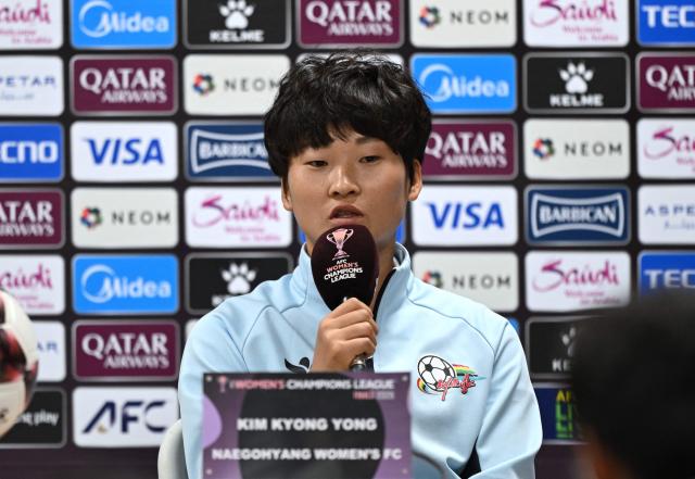 North Korea's Naegohyang Women's FC player Kim Kyong Yong speaks during a press conference at Suwon Sports Complex in Suwon on May 22, 2026, ahead of the AFC Women's Champions League final football match. (Photo by Jung Yeon-je / AFP)