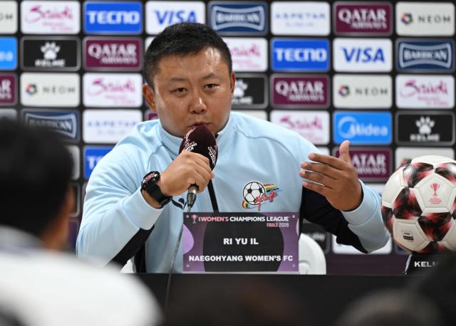 North Korea's Naegohyang Women's FC head coach Ri Yu Il speaks during a press conference at Suwon Sports Complex in Suwon on May 22, 2026, ahead of the AFC Women's Champions League final football match. (Photo by Jung Yeon-je / AFP)