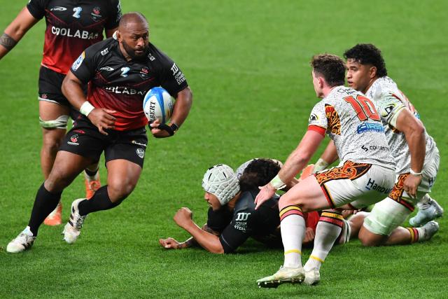 Crusaders' George Bower (L) runs with the ball during the Super Rugby Pacific match between the Crusaders and Chiefs at One New Zealand Stadium in Christchurch on May 22, 2026. (Photo by Sanka Vidanagama / AFP)