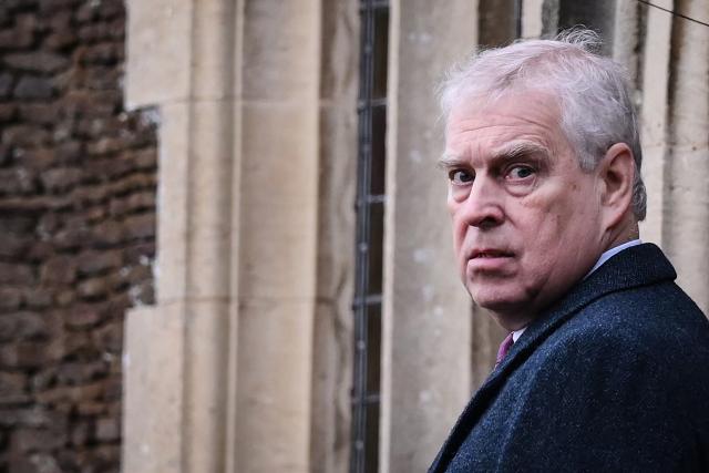 (FILES) Britain's then-Prince Andrew, Duke of York reacts as he arrives for the Royal Family's traditional Christmas Day service at St Mary Magdalene Church in Sandringham, Norfolk, eastern England, on December 25, 2022. UK police investigating former prince Andrew said on May 22, 2026 they are also open to probing claims of sexual misconduct against the king's brother. Andrew, the second of the late queen Elizabeth II's three sons and brother to King Charles III, was arrested in mid-February after new revelations stemming from his ties to the late billionaire US sex offender Jeffrey Epstein. (Photo by Daniel LEAL / AFP)