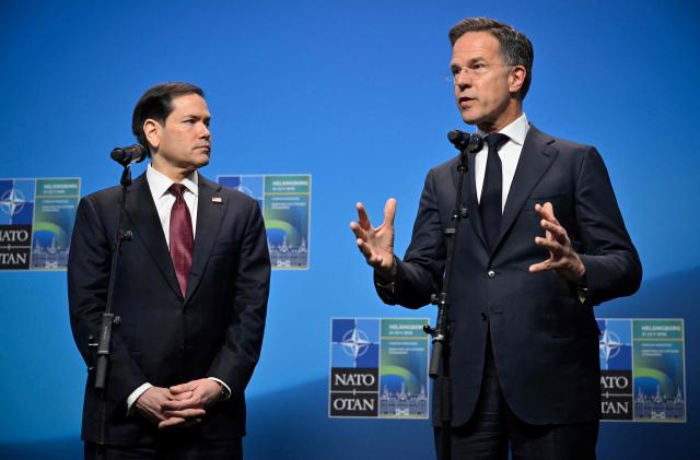 NATO Secretary General Mark Rutte (R) and US Secretary of State Marco Rubio give remarks at the NATO Foreign Ministers' meeting in Helsingborg, Sweden, on May 22, 2026. Foreign ministers of the 32 NATO member states gathered in the Swedish city to finalise preparations for the upcoming Ankara Summit. (Photo by Johan NILSSON / TT NEWS AGENCY / AFP) / Sweden OUT