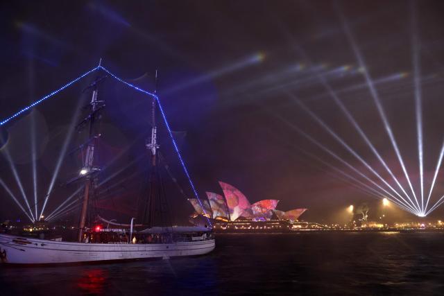 The sails of the Sydney Opera House are illuminated with lights on the opening night of the annual Vivid Sydney festival in Sydney on May 22, 2026. (Photo by David GRAY / AFP)