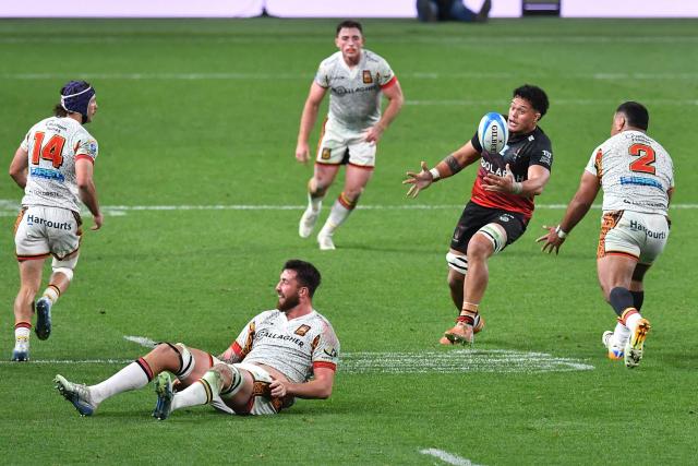 Crusaders' Christian Lio-Willie (2nd R) attempts to secure the ball during the Super Rugby Pacific match between the Canterbury Crusaders and Waikato Chiefs at One New Zealand Stadium in Christchurch on May 22, 2026. (Photo by Sanka Vidanagama / AFP)