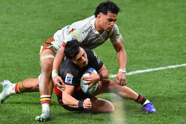 Crusaders' Taha Kemara is tackled by Chiefs' Wallace Sititi during the Super Rugby Pacific match between the Canterbury Crusaders and Waikato Chiefs at One New Zealand Stadium in Christchurch on May 22, 2026. (Photo by Sanka Vidanagama / AFP)