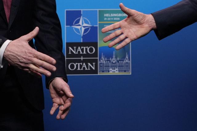 NATO Secretary General Mark Rutte (R) and US Secretary of State Marco Rubio shake hands after giving remarks at the NATO Foreign Ministers' meeting in Helsingborg, Sweden, on May 22, 2026. Foreign ministers of the 32 NATO member states gathered in the Swedish city to finalise preparations for the upcoming Ankara Summit. (Photo by Julia Demaree Nikhinson / POOL / AFP)