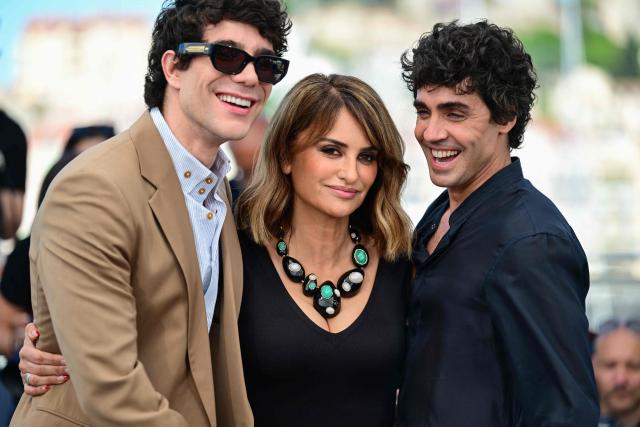 Spanish director, screenwriter and producer Javier Calvo, Spanish actress Penelope Cruz and Spanish director, screenwriter and producer Javier Ambrossi pose during a photocall of the film "La Bola Negra" at the 79th edition of the Cannes Film Festival in Cannes, southern France on May 22, 2026. (Photo by Olivier CHASSIGNOLE / AFP)
