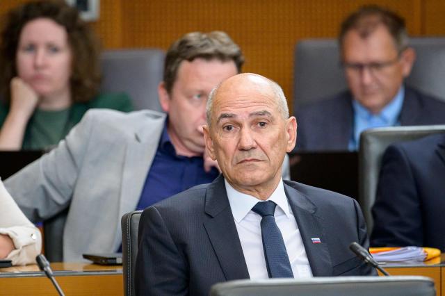 Right-wing Slovenian Democratic Party (SDS) leader Janez Jansa looks on ahead of his investiture vote as prime minister in Ljubljana on May 22, 2026. Jansa, 67, said on May 18, 2026 his Slovenian Democratic Party (SDS) had reached a coalition deal with two centre-right parties -- Christian democratic party Nova Slovenija and his former close ally Anze Logar's Democrats -- giving them 43 out of 90 seats in parliament. If confirmed, Jansa would begin a fourth term as prime minister, two months after Slovenia's inconclusive March 22 parliamentary election in which his party and outgoing Prime Minister Robert Golob's Freedom Movement finished virtually tied. (Photo by Jure Makovec / AFP)