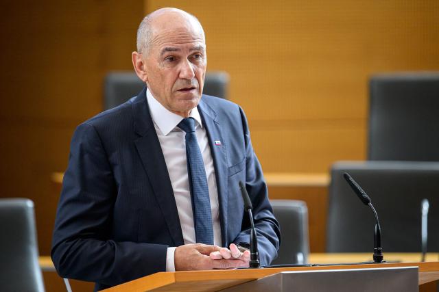 Right-wing Slovenian Democratic Party (SDS) leader Janez Jansa addresses members of the National Assembly ahead of his investiture vote as Prime minister in Ljubljana on May 22, 2026. Jansa, 67, said on May 18, 2026 his Slovenian Democratic Party (SDS) had reached a coalition deal with two centre-right parties -- Christian democratic party Nova Slovenija and his former close ally Anze Logar's Democrats -- giving them 43 out of 90 seats in parliament. If confirmed, Jansa would begin a fourth term as prime minister, two months after Slovenia's inconclusive March 22 parliamentary election in which his party and outgoing Prime Minister Robert Golob's Freedom Movement finished virtually tied. (Photo by Jure Makovec / AFP)